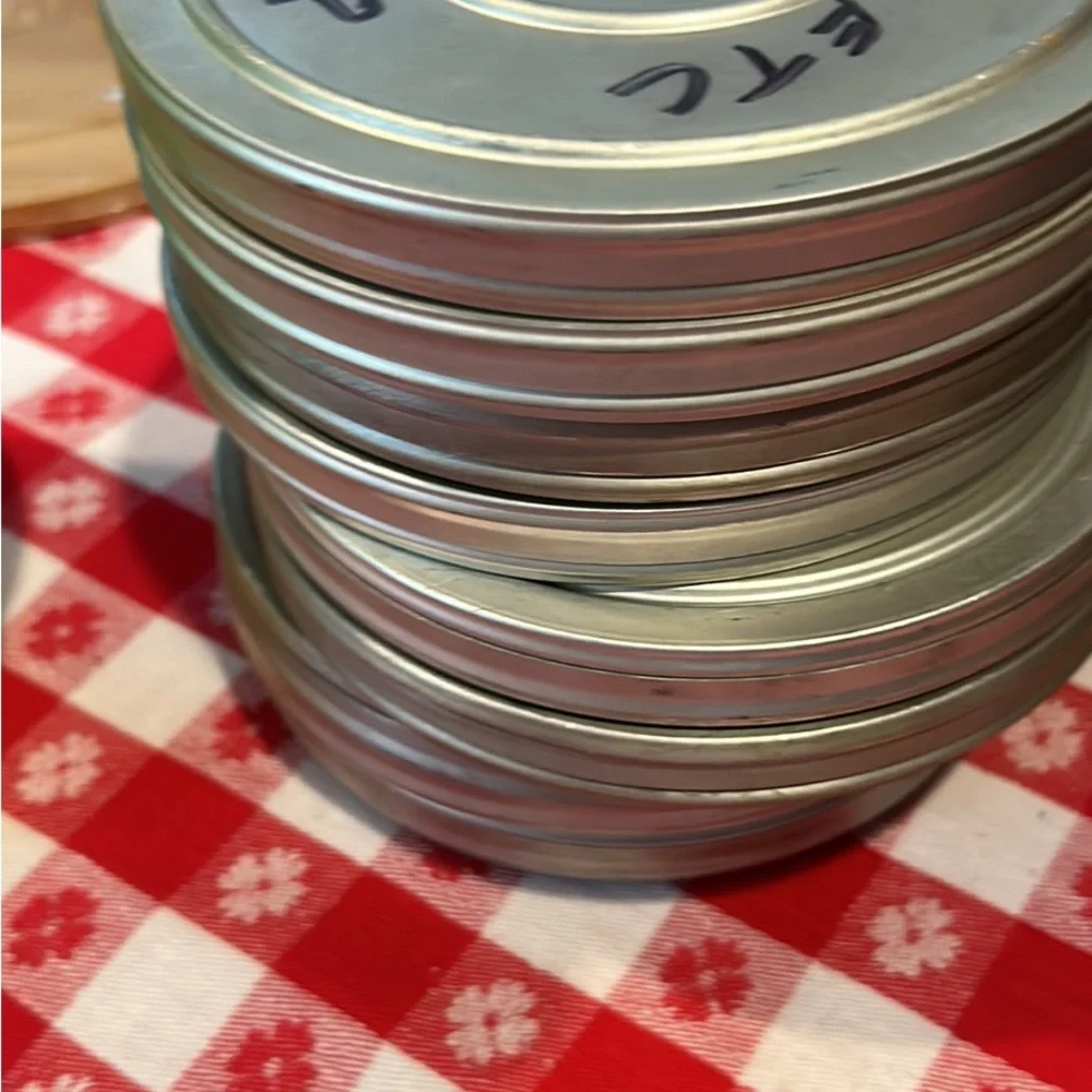 Vintage tin movie reel container with lock